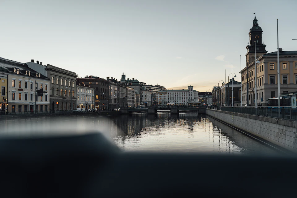 River running between city buildings